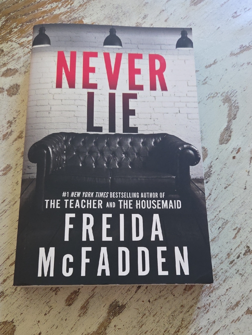 Never Lie by Freida McFadden - Black & Red Paperback Thriller